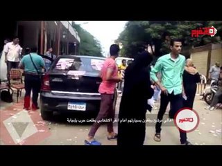 سيارة لمرشح تكسر الصمت الانتخابي وتقف أمام باب لجنة في إمبابة