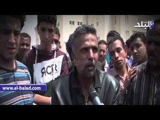 وزير الداخلية يحتضن نجل الشهيد وائل طاحون أثناء تشييع الجنازة