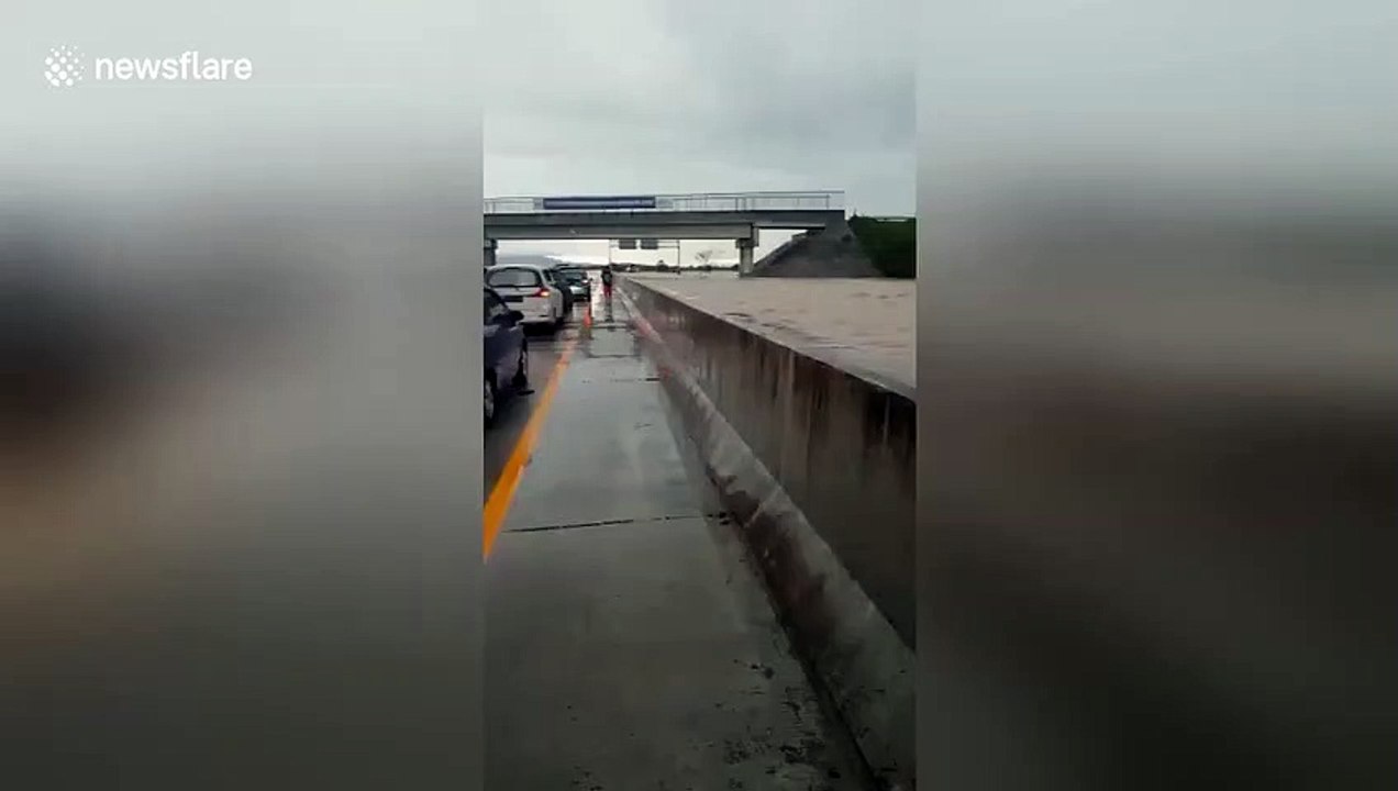 Indonesian floods sees one side of major East Java highway completely submerged
