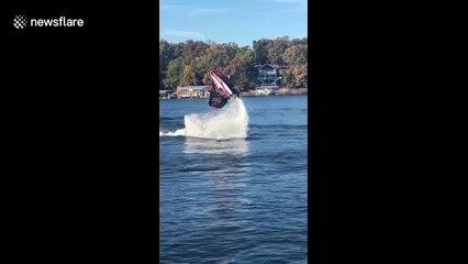 Jet skier makes a splash with a double flip during stunt jump attempt