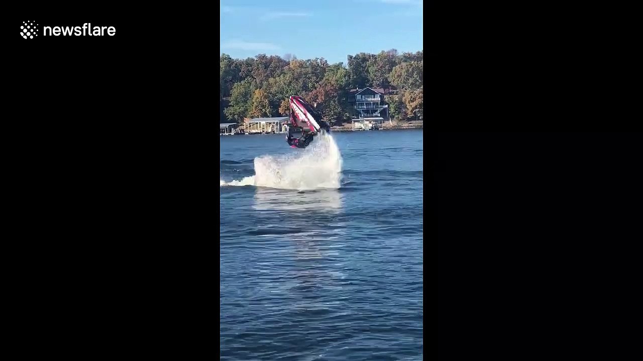 Jet skier makes a splash with a double flip during stunt jump attempt