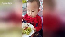 Two-year-old boy uses chopsticks like a pro