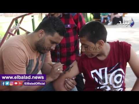 صدى البلد | الأطفال يرسمون وجوههم احتفالا بالعيد..