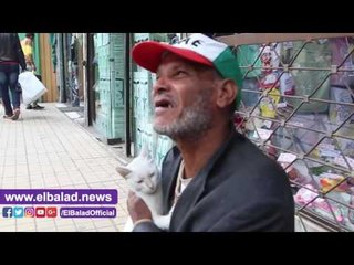 صدى البلد | مواطن يحتضن قطة : " سوسن تغنيني عن البني آدمين "