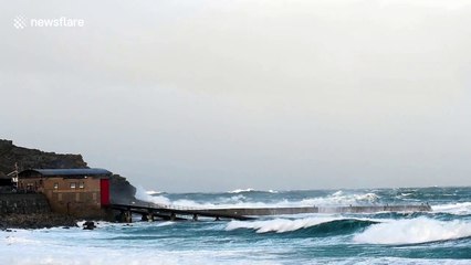 Gale force winds and waves batter the Cornish coast at Sennen