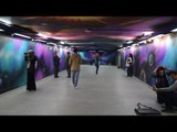 صدى البلد | مبدعون يزينون جدران مترو الاوبرا بلوحات فنية