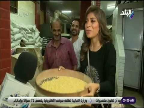 صباح البلد - شاهد .. لميس سلامة تشارك عمال مصنع حلويات فى تحضير السمسمية على الهواء