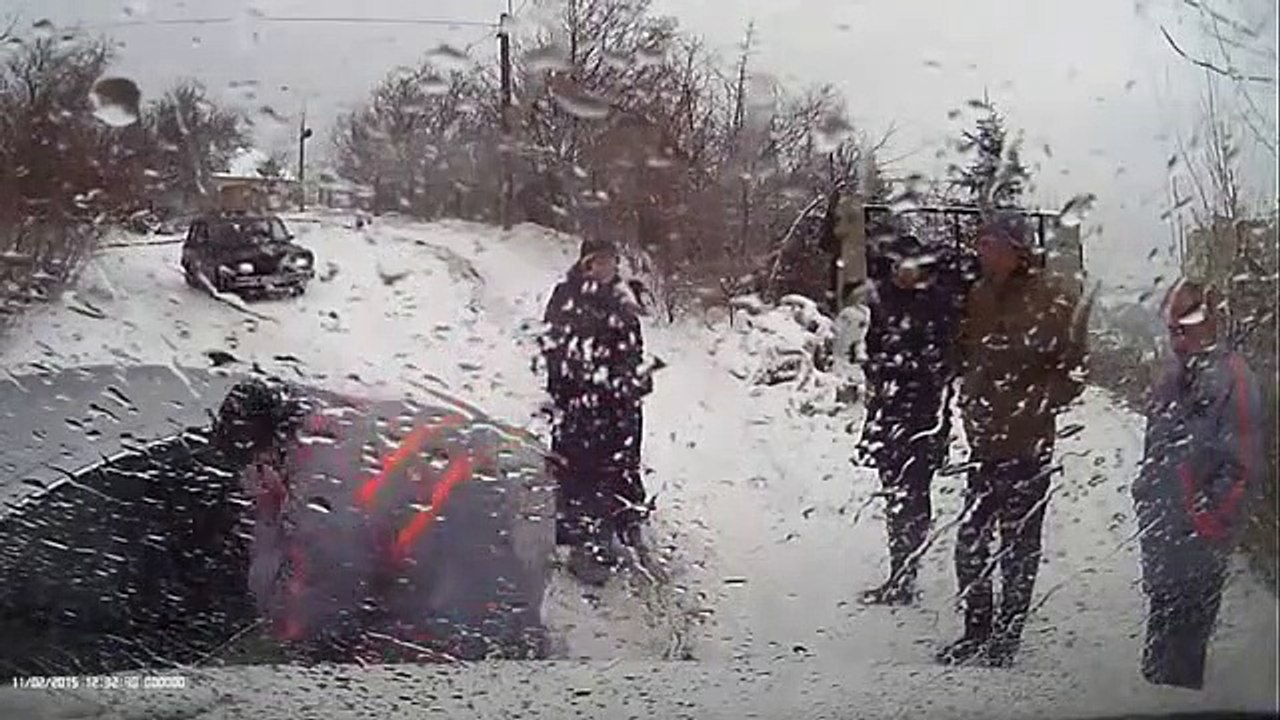 Cars struggle on snowy road