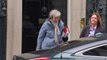 Theresa May and Philip Hammond depart Downing Street