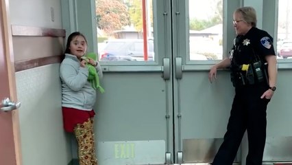Heartwarming Moment Officer Comforts Student With Down Syndrome