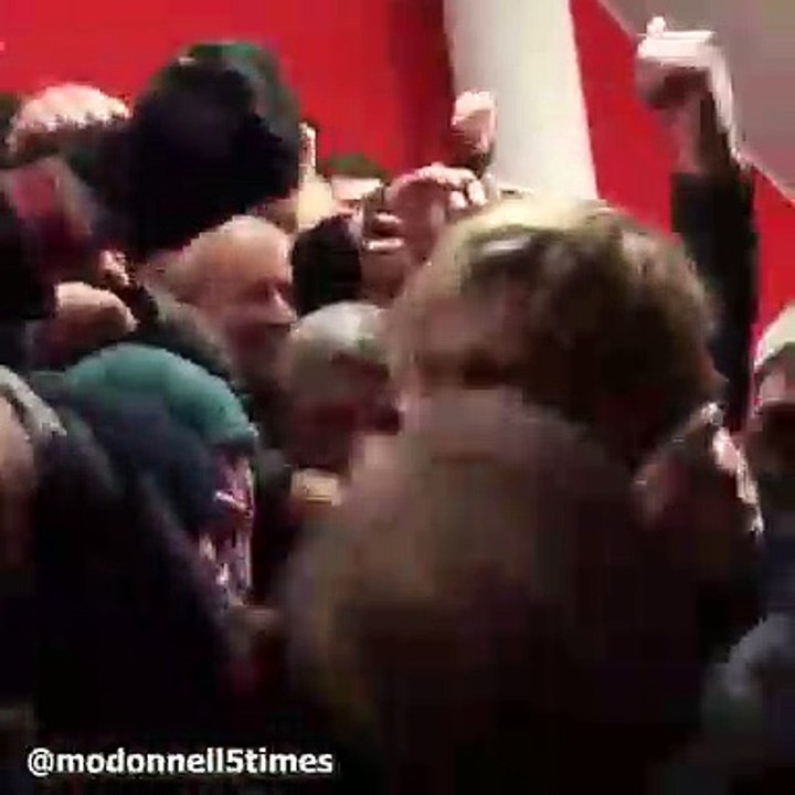 Liverpool fans celebrate Bayern victory by mobbing Sami Hyypia
