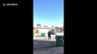 Man makes awesome deflection ball shot through basketball hoop