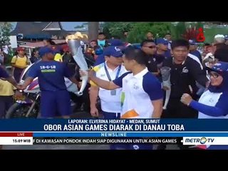 Keseruan Kirab Obor Asian Games di Danau Toba