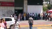 Longas filas por dois dólares na Venezuela