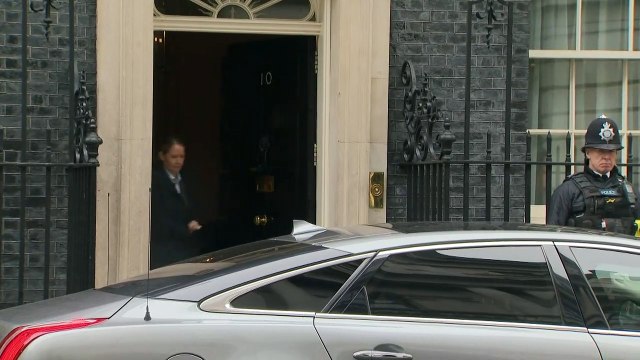Theresa May departs 10 Downing Street for PMQs