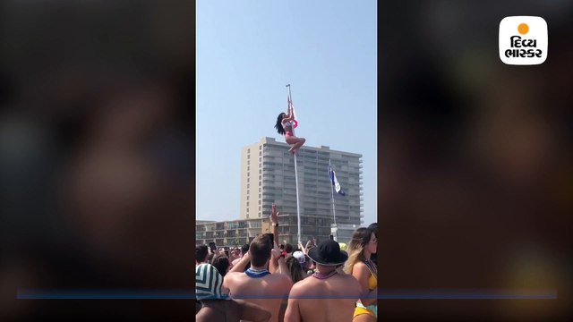 બીચ પર મસ્તી કરતાં કરતાં ચડી ગઈ થાંભલા પર, એવી નીચે પટકાઈ કે લોકોએ પણ કરી ટ્રોલ