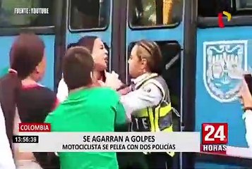 Colombia: impresionante pelea de motociclista con policías de tránsito