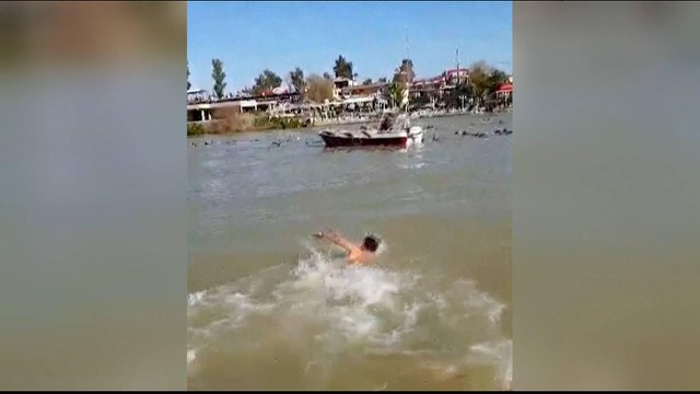 Overloaded ferry sinks in Iraq's Tigris River, at least 100 die