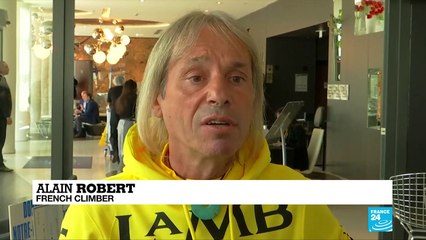 French 'spiderman' scales Notre Dame to raise renovation funds