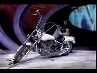 Triple H hammers at undertakers bike