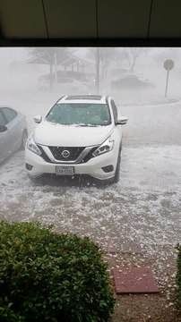 Hail Storm Beats and Batters a Car