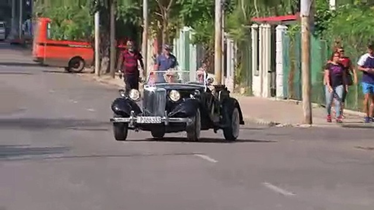 Prince Charles drives classic MG at Havana vintage car rally