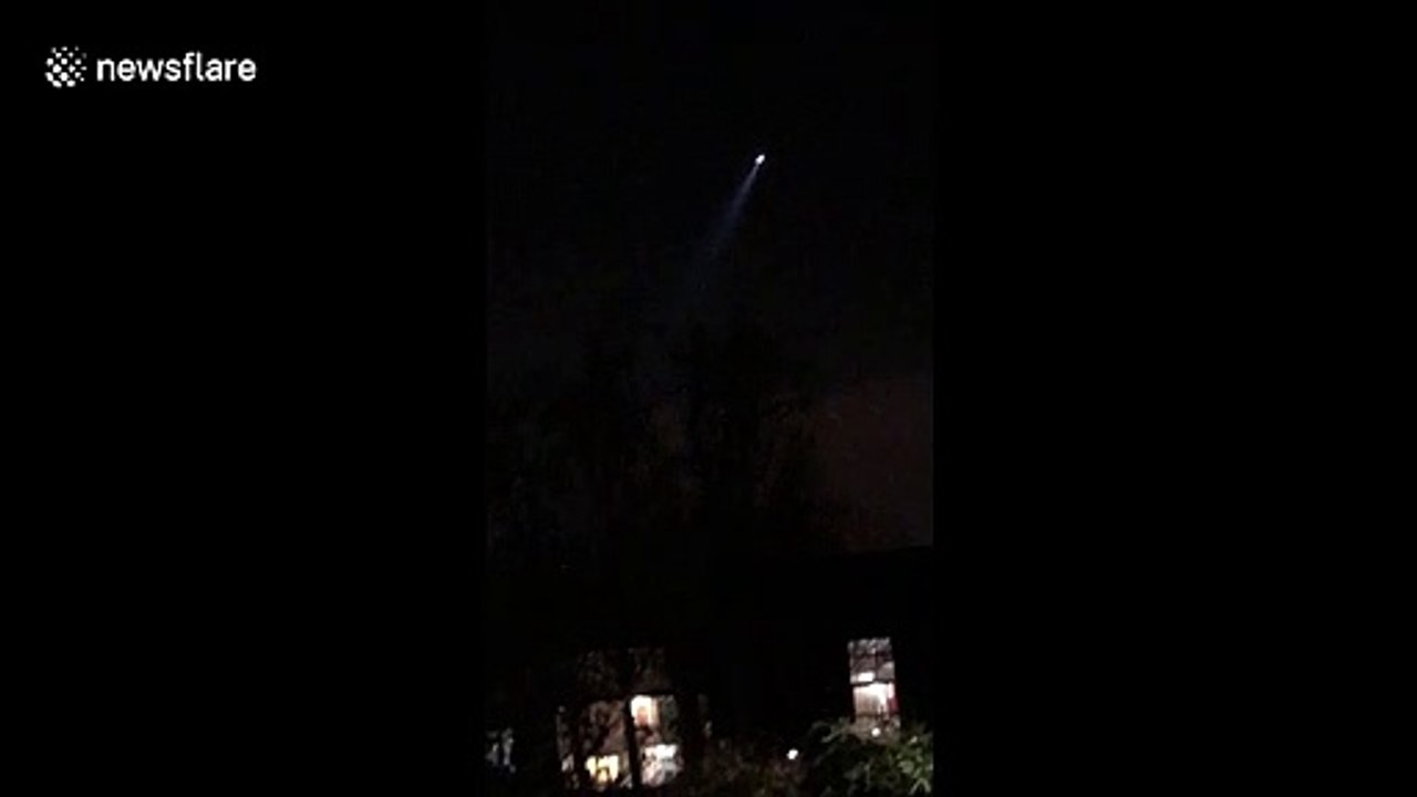 Police helicopters circle over suspected burglars standing on northwest London roof