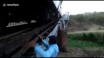 That's dedication! Brave train driver risks life to fix train after it stops on bridge in central India