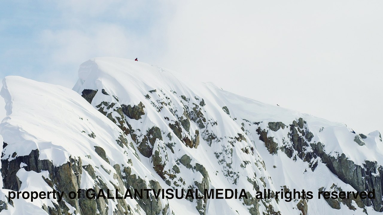 Snowmobile Sends It Off 150 Foot Drop