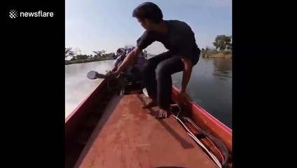 Man in Thailand shows off EXTREME engine power on his longtail boat