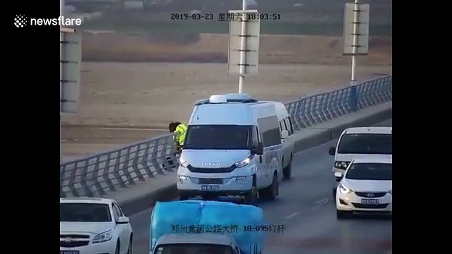 Heroic woman grabs suicidal man to save him from jumping off bridge