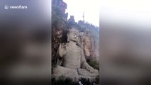 Wasps build nest on forehead of giant Buddha statue in China's Hangzhou