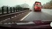 Car narrowly avoids head-on collision as truck veers out of control
