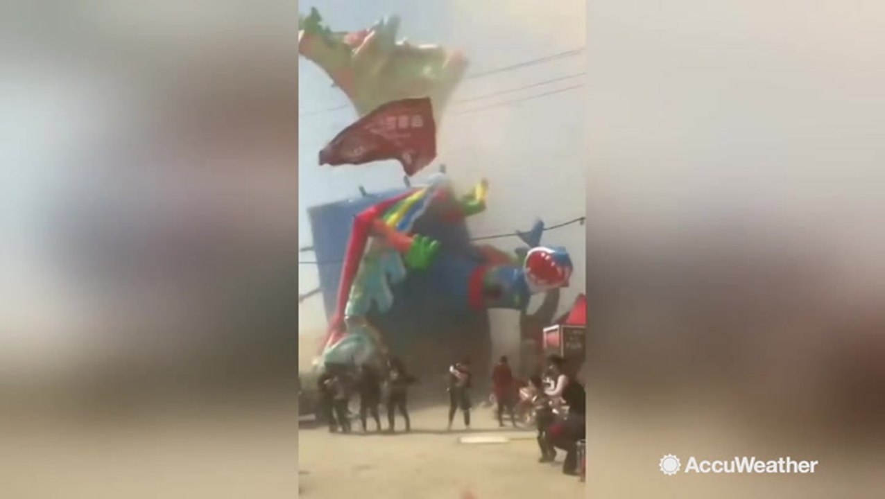 Frightening video shows dust devil sweep bouncy house into air, killing two children