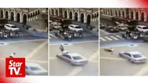 Cop rammed by car while directing traffic