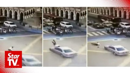 Cop rammed by car while directing traffic