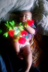 Small children playing with flowers