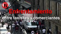 Enfrentamiento entre taxistas y comerciantes