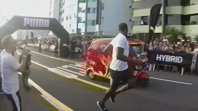 Watch: Usain Bolt jogs to victory in race against tuk-tuk