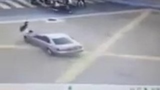 Shocking moment a car rams into a traffic cop in KL