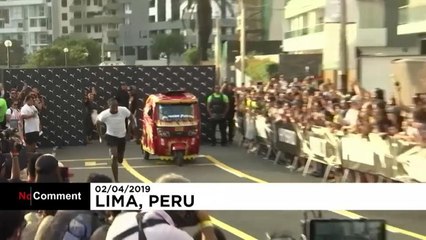 Bolt races against a motorcycle taxi and wins