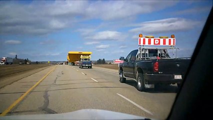 MCH 69 . LARGEST MONSTER DUMP TRUCK IN THE WORLD BEING TRASPORTED TO FORT McMURRY TAR SANDS ALBERTA CANADA.