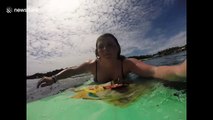 Brit woman's mission to clear Bali seas from plastic on her surfboard