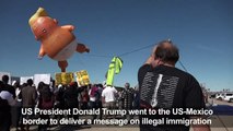 Baby Trump balloon greets Trump at US-Mexico border