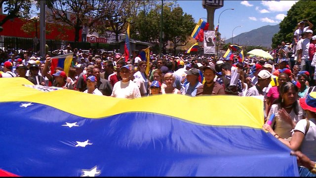 Venezuelans take to the streets as power struggle persists