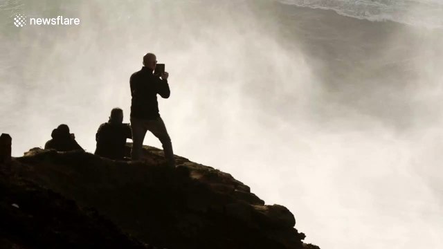 Surfer's massive wipeout followed by incredible jet ski rescue in Portugal
