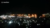 Thousands protest outside Sudan army HQ with phones in the air
