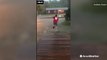 Man disappears in floodwater as he runs across front yard
