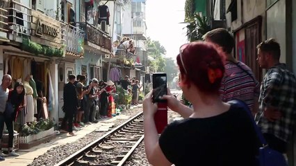 Train Passes Through Tiny Street in Vietnam