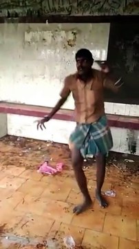 This looks like a crazy guy dancing in a bad shelter! In Sri Lanka!
